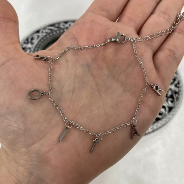 a Pulsera con dijes "soltar" y REIR