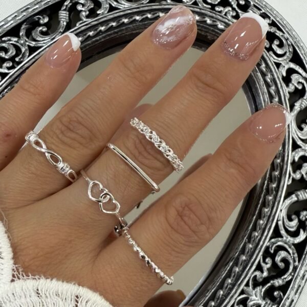 a a kit x 5 anillos plata mod L